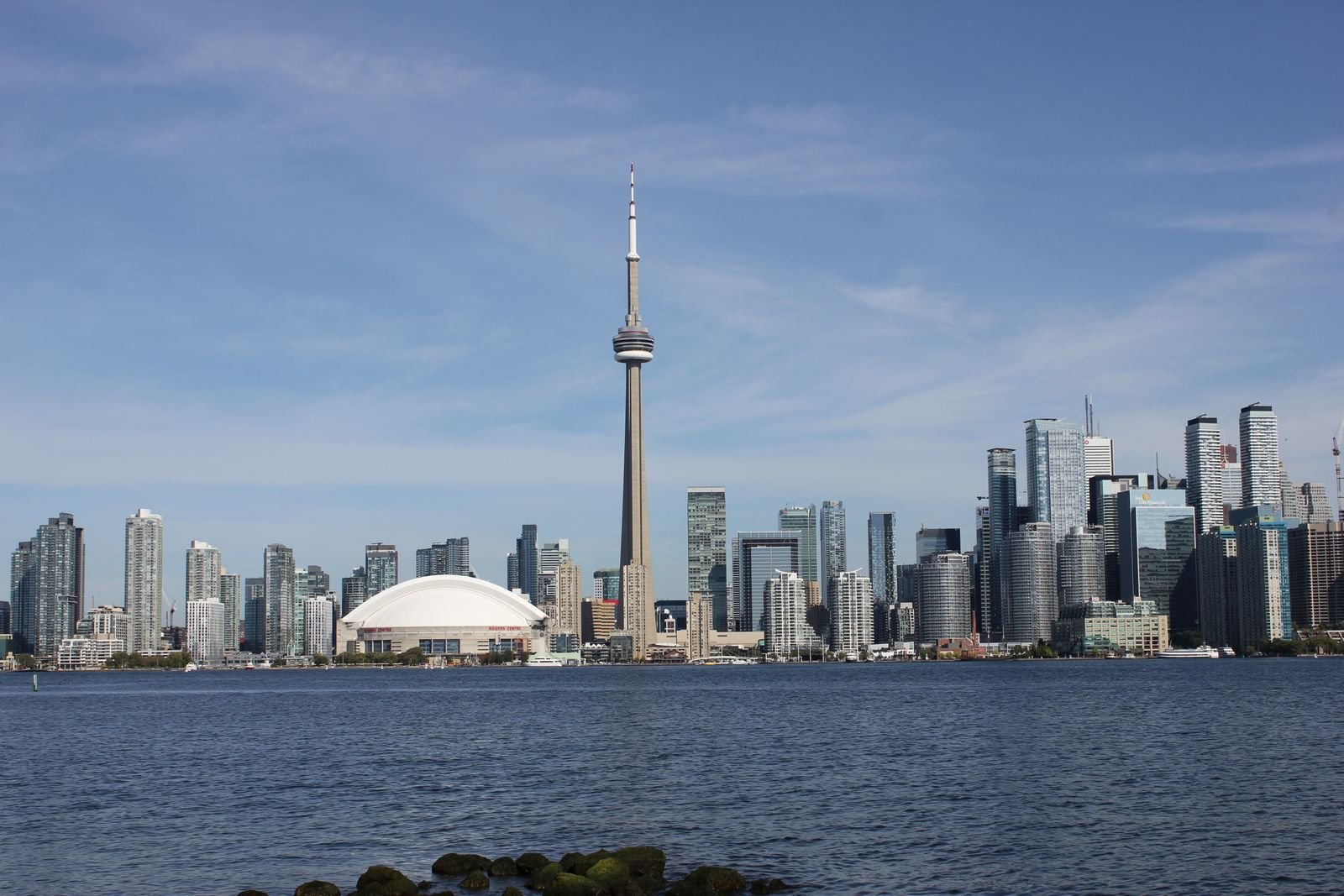 City skyline in daylight with a tall observation tower among downtown high-rises